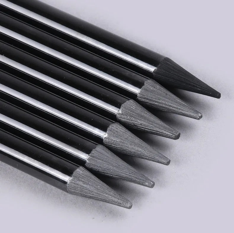 Solid graphite and carbonised artist pencil set with wooden shells for drawing and sketching