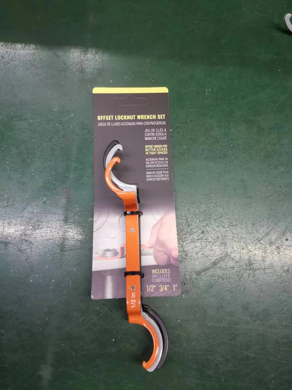 Orange, grey, and black magnetic suction wrench set with catheter lock, shown with size comparison.
