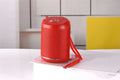 Portable outdoor Bluetooth subwoofer in multiple colour options including black, blue, and camouflage.