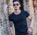 Men's lightweight bamboo fibre summer T-shirt on a hanger, showing colour options for black, blue, grey, green, red, and white.