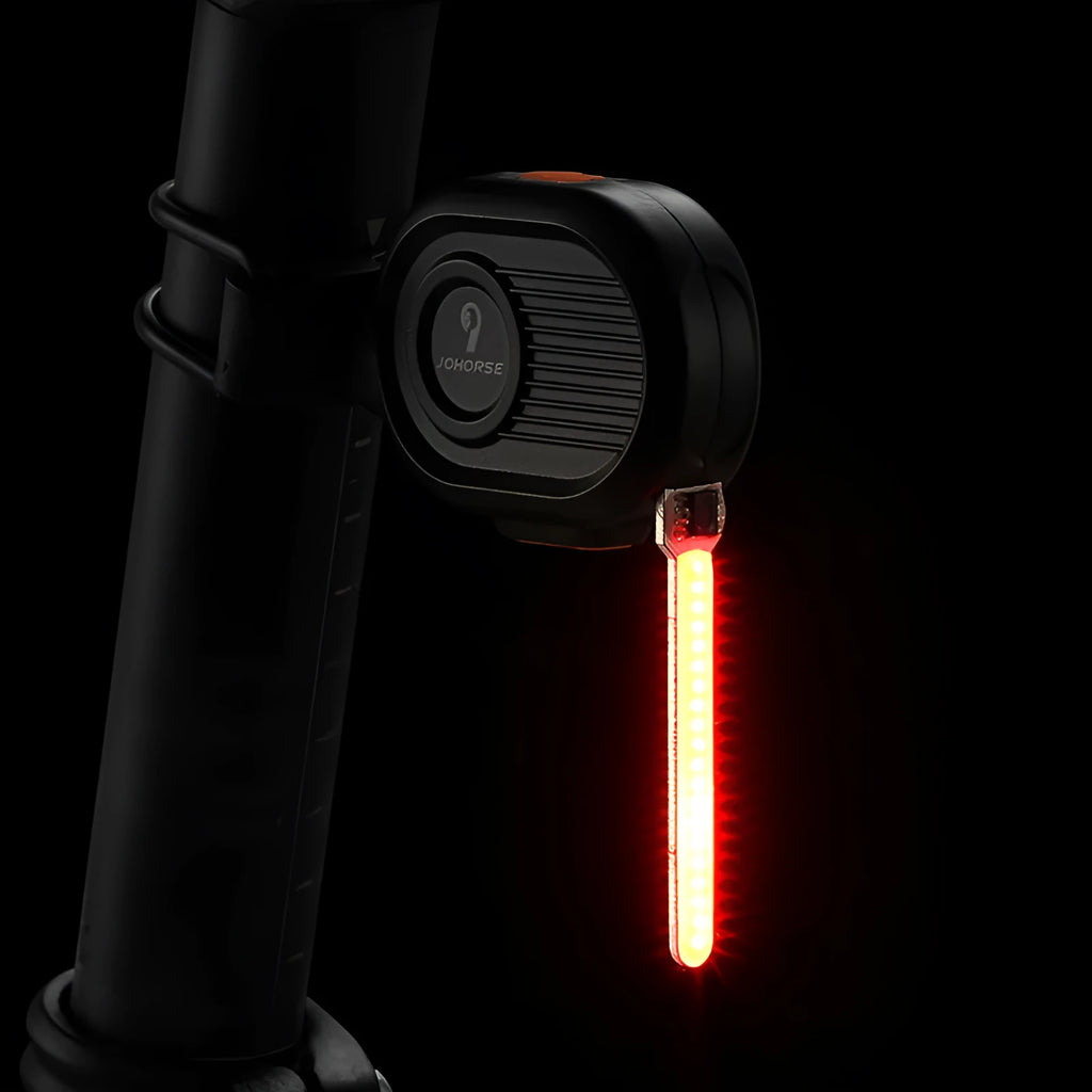 Bicycle running water taillight showing a blue waterfall LED light effect mounted on a bike seat post.