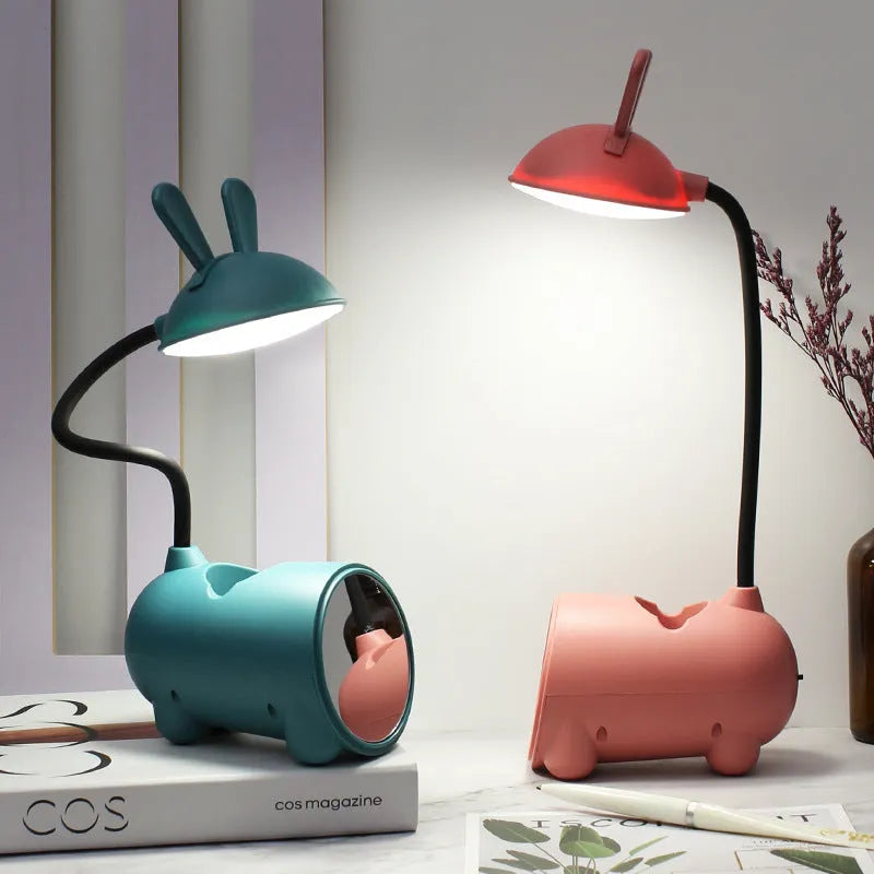 Green cartoon desk lamp with USB power and built-in pen holder container on desk