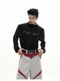 Man wearing a black niche mesh slim-fit long sleeve shirt showing texture and fit.
