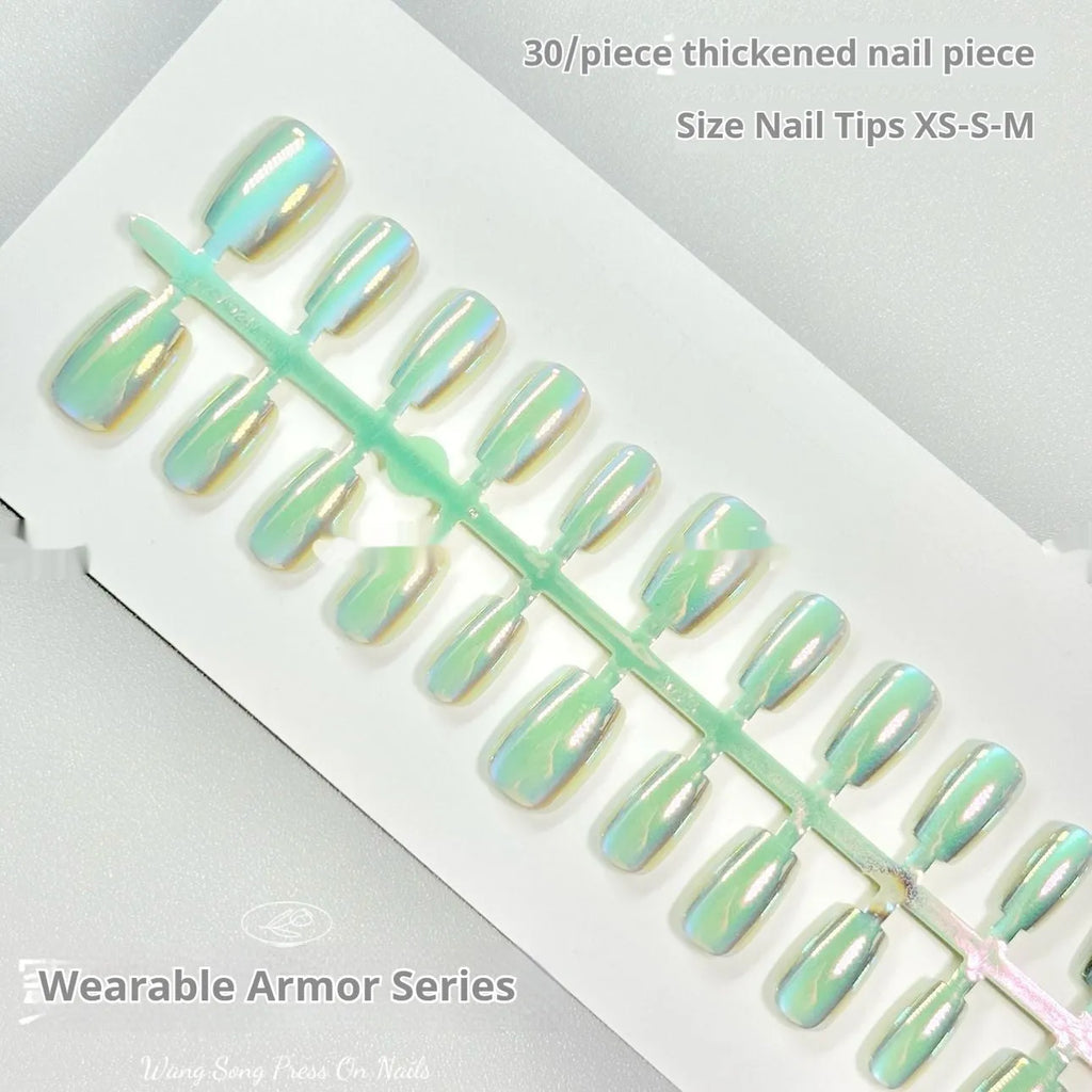 Electroplated Cat's Eye aurora glitter false nails in short ladder shapes on a white background.