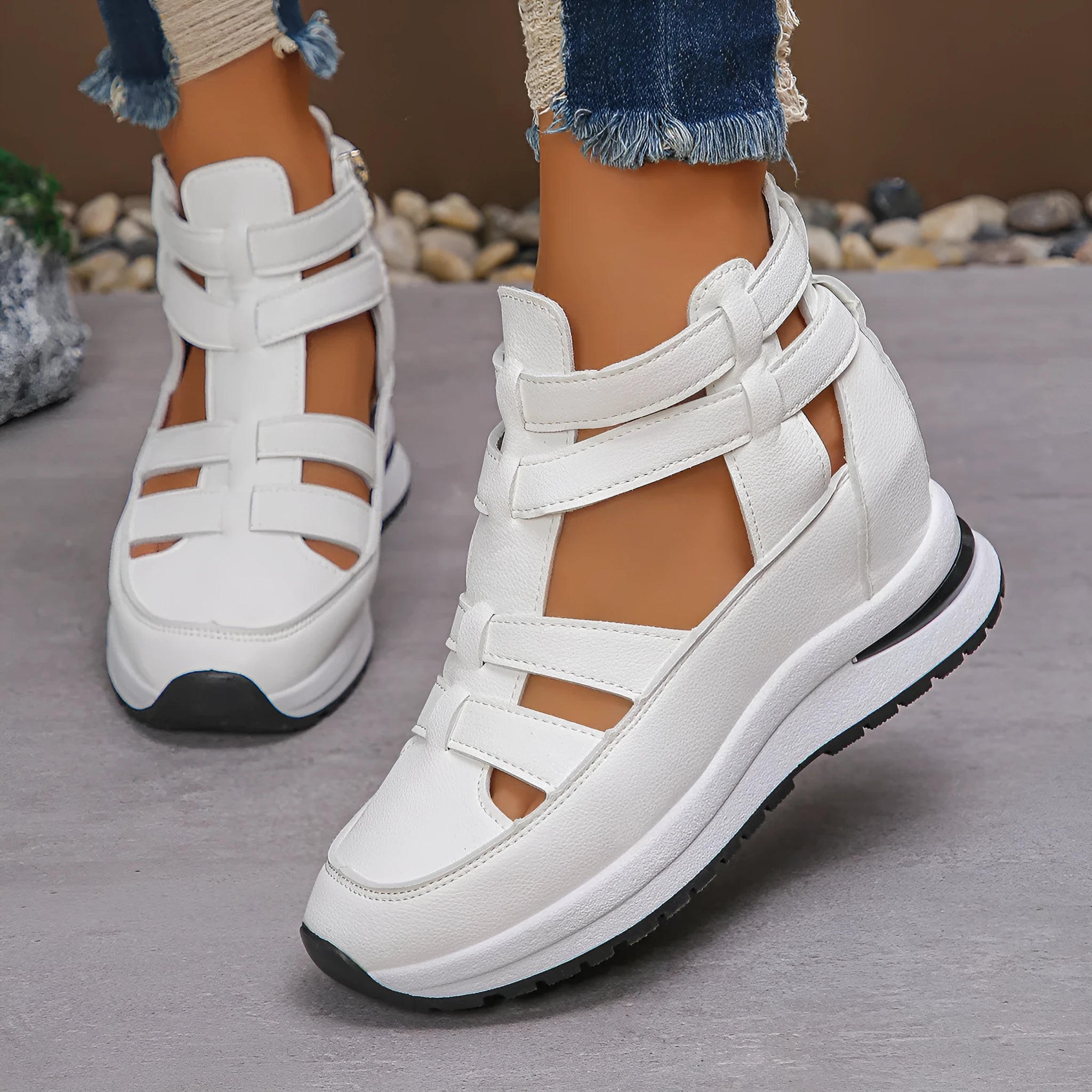 Women's black platform sandals with hollow-out design and Velcro strap.