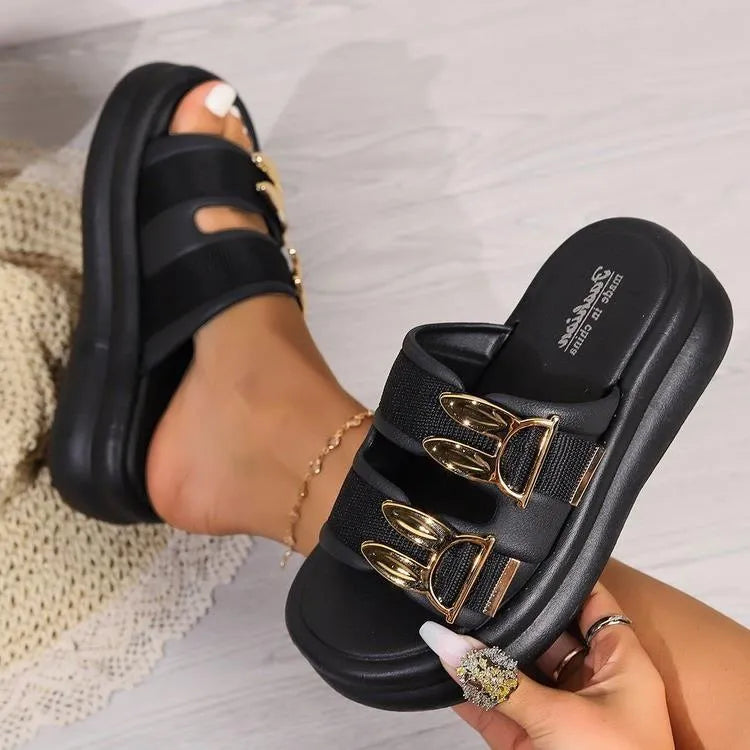 Women's apricot suede slippers with a thick rubber sole, shown from the side.