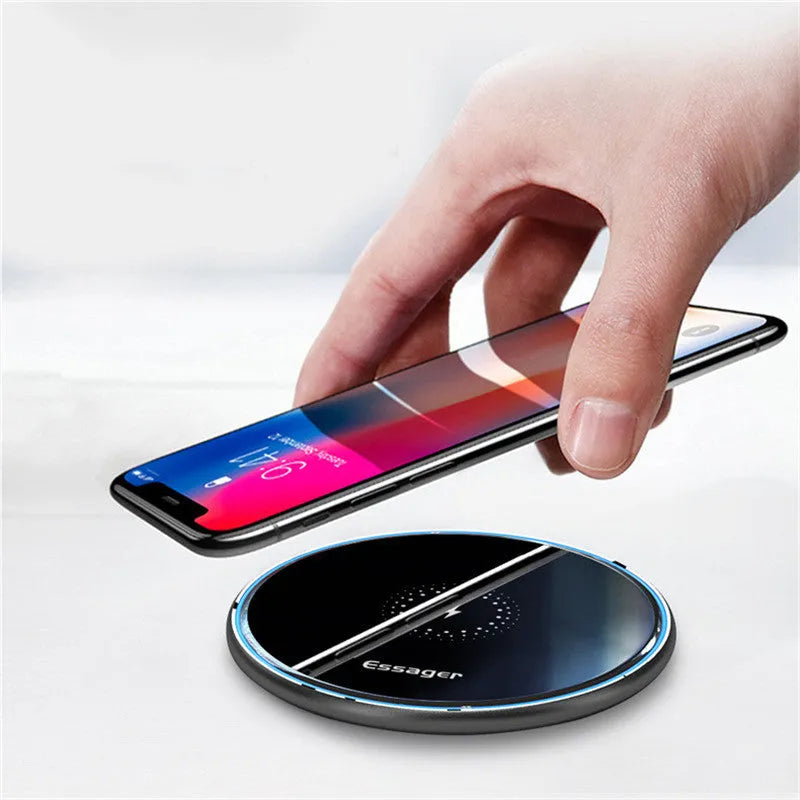 Black or white aluminium alloy wireless charging pad with LED status light, shown with a smartphone on top.