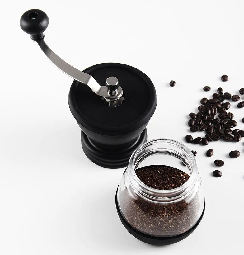 Beech wood hand grinder coffee machine with black finish, 88 mm wide, on a table