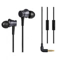 Black, blue, and red wired in-ear headphones showing their 3.5mm audio plug.