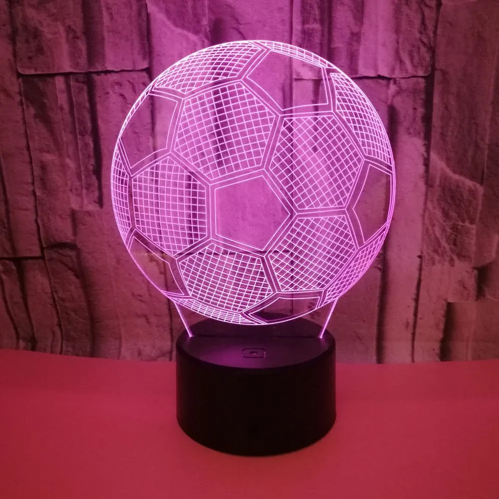 3D football-shaped acrylic night light glowing in blue with a black ABS base and remote control.