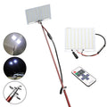 White LED fishing rod light unit mounted on a tall telescopic pole for outdoor portable lighting.