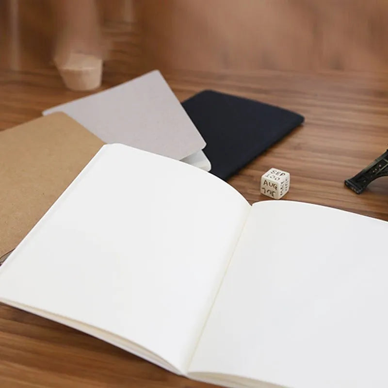Retro solid-colour A6 graffiti notebook open on a blank page.