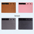 Pink wireless charging mouse pad with phone holder on a wooden desk