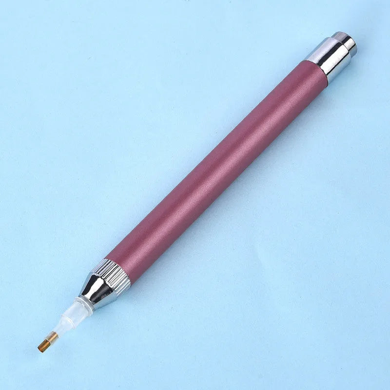 Luminous single-head diamond painting drill pen in gold, red, or blue with metal frame.
