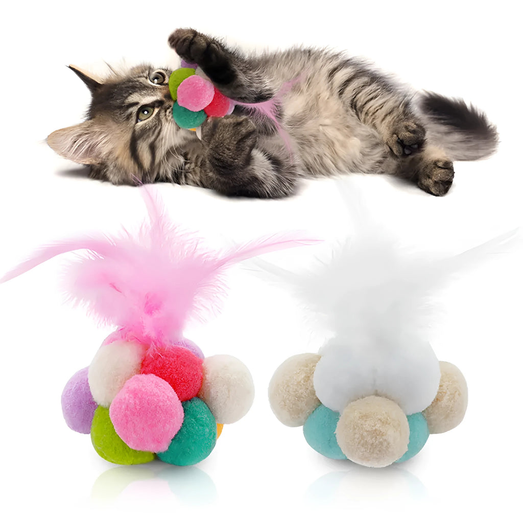 Colourful cat toy feather bouncy ball with pink feathers on a white background