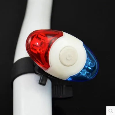 Red and blue LED bicycle tail light with adjustable mounting base.