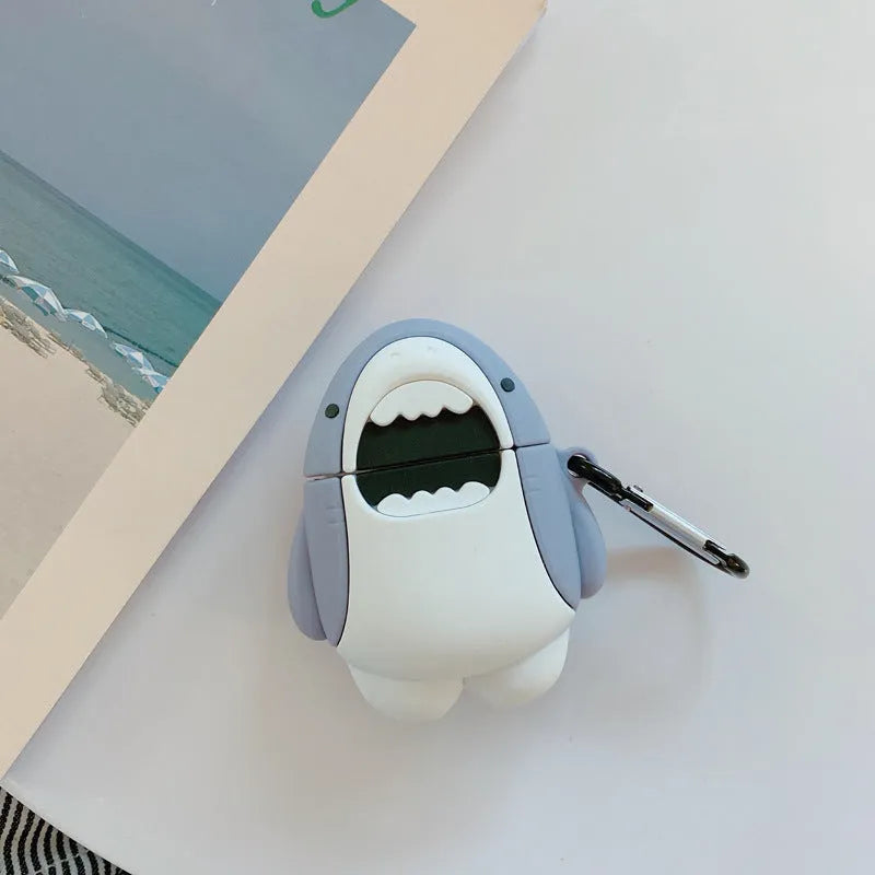 Soft silicone cover with shark fin design on a white Apple Airpods 1 wireless earbud.