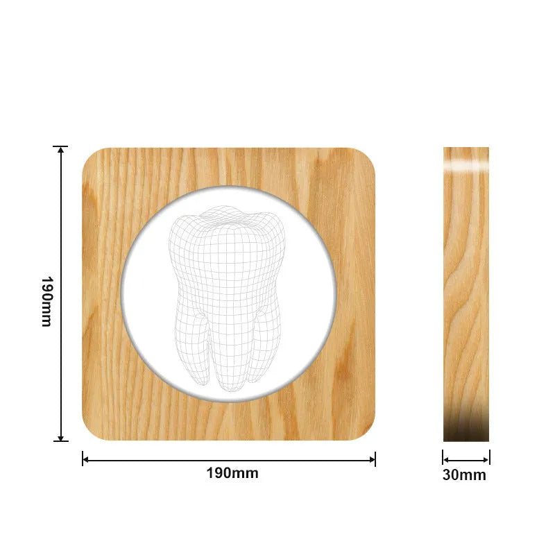 Tooth-shaped wood colour acrylic USB night light on a surface, showing compact size.
