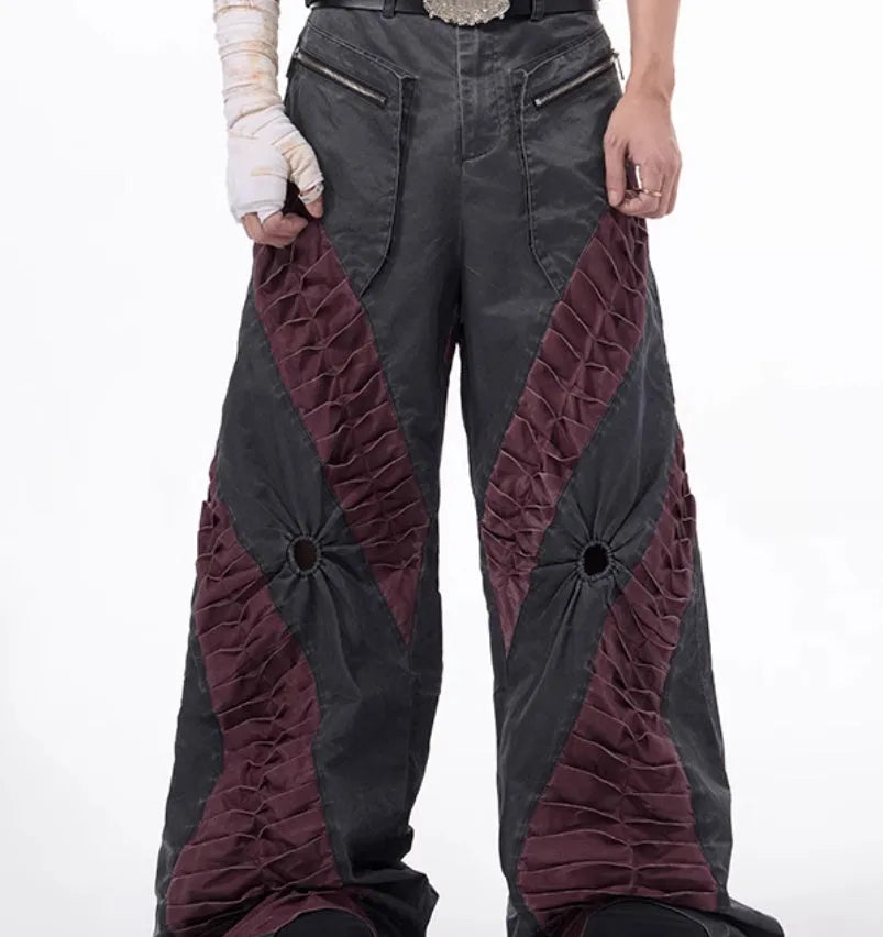 Men's slim-fit grey trousers with textured keel detailing on the legs.