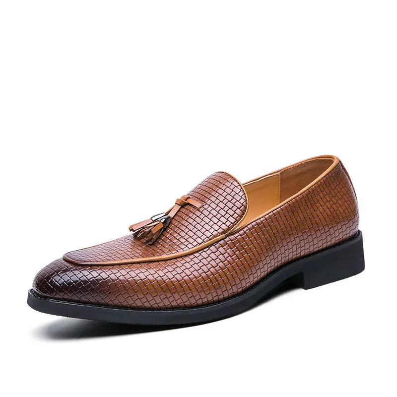 Men's black slip-on business shoes with pointed toe and tassel detail on artificial PU upper