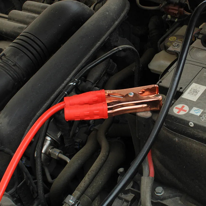 Black and red car battery jump leads with metal clip holders on a 2-metre cable.