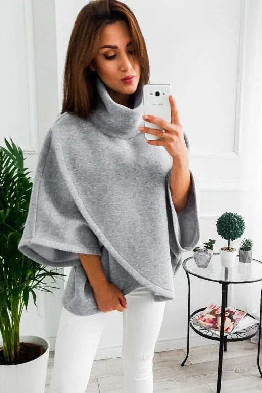 Women's long black batwing sleeve cardigan sweatshirt with three buttons and stitching detail.