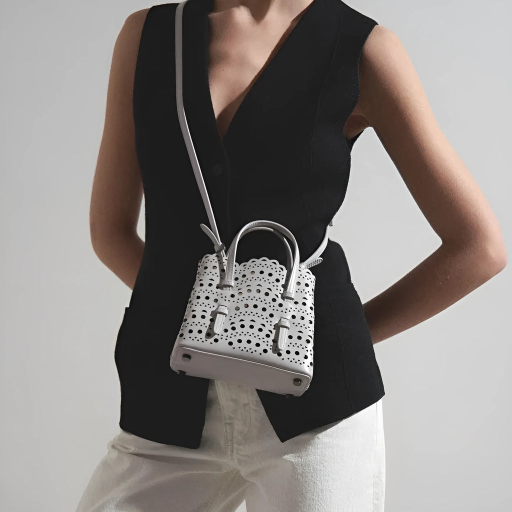 Hollow carved pattern tote messenger bag in horizontal square shape with three strap points