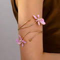 Alloy armband ring with hollow pattern design in pink colour showing adjustable sliding clasp