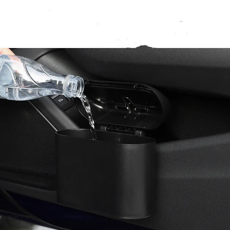 Black ABS car trash can with upturned lid and removable hook, 160x143x85mm, on car seat