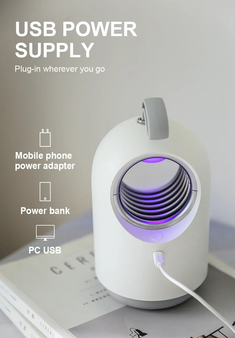 Blue or white indoor mosquito killer lamp with UV light, USB port, and silicone carry handle.