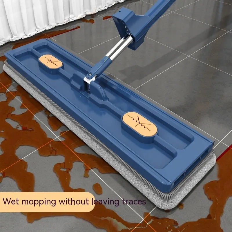 Large flat mop with stainless steel handle and 360-degree rotating head on hard floor