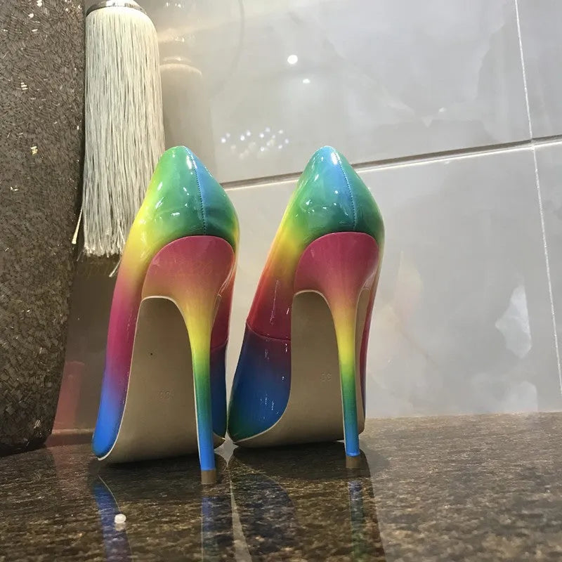 Rainbow coloured patent leather women's high heels with pointed toe and thin ultra-high heel.
