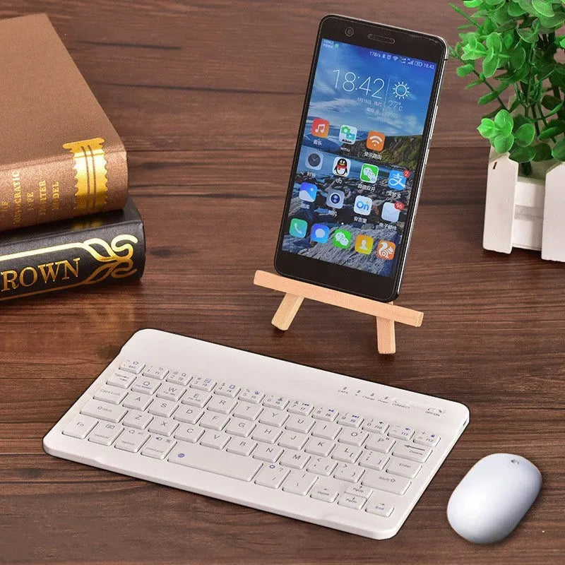 Compact black or white mini Bluetooth wireless keyboard for tablets with a 10-metre range.
