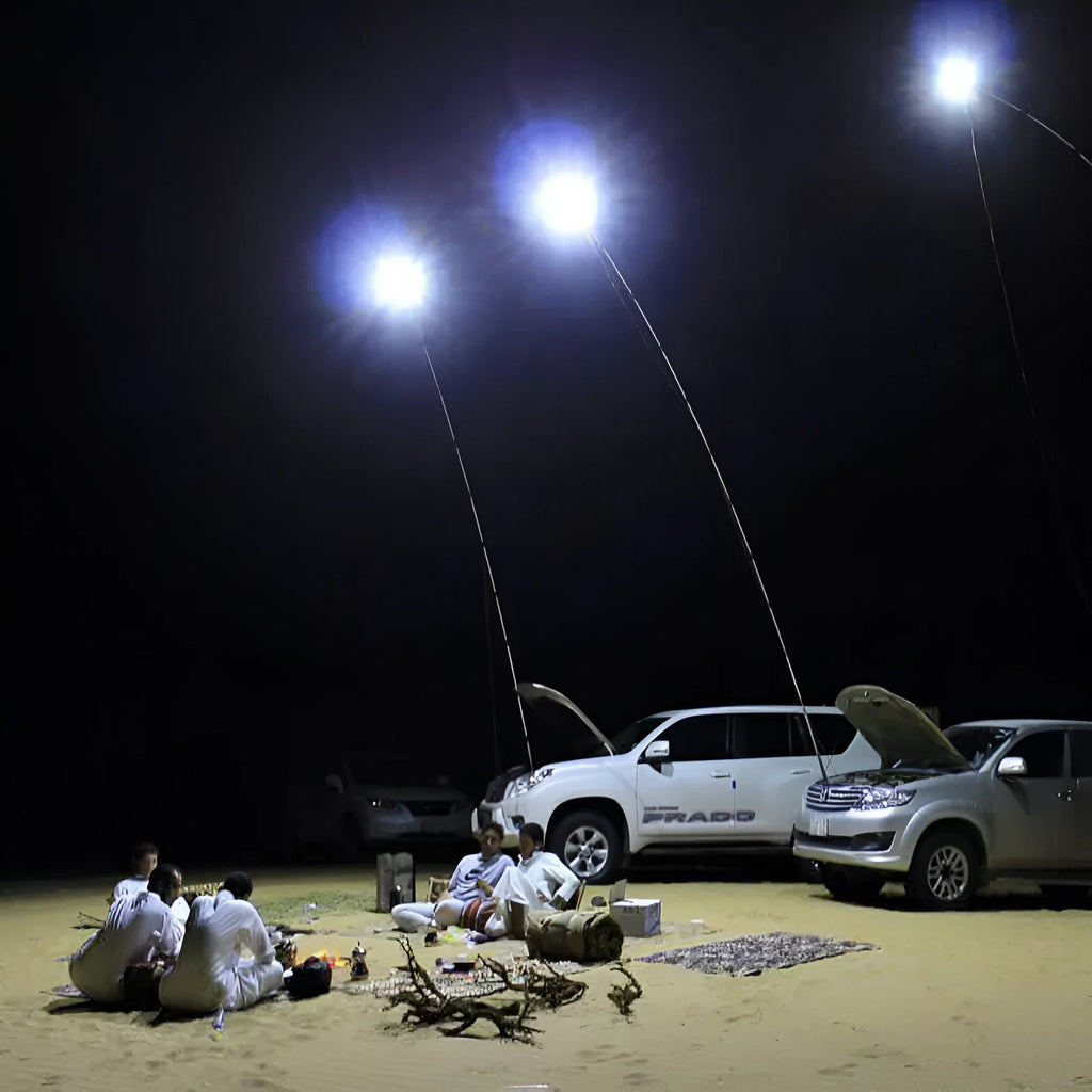 White LED fishing rod light unit mounted on a tall telescopic pole for outdoor portable lighting.