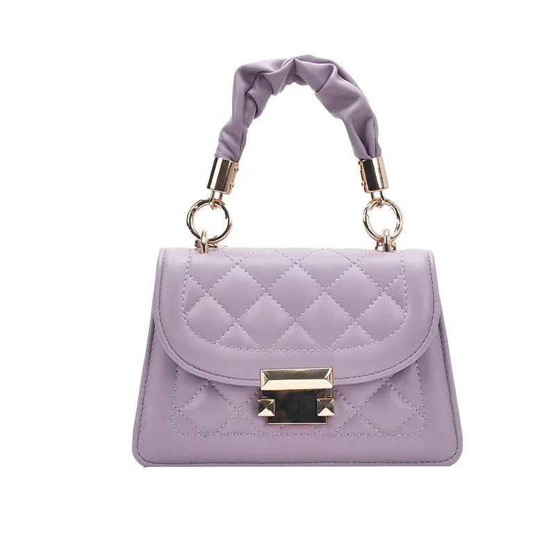 A purple PU leather small square women's crossbody bag with a chain detail and a long strap.
