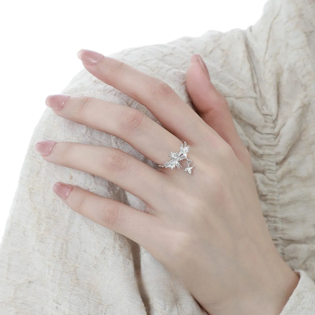Adjustable silver ring with a detailed wild butterfly design in a white gold or 18K gold colour finish.