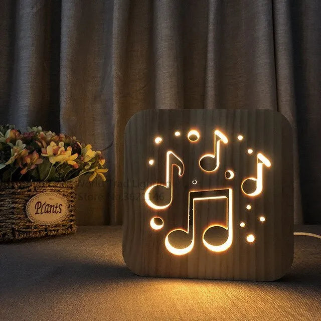 Square pine wood USB LED atmosphere lamp emitting warm white light on a desk.
