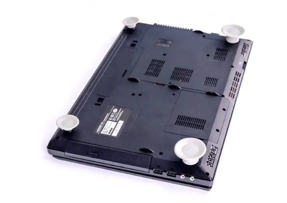 Grey laptop cooling pad set with four durable plastic pads for laptop temperature reduction