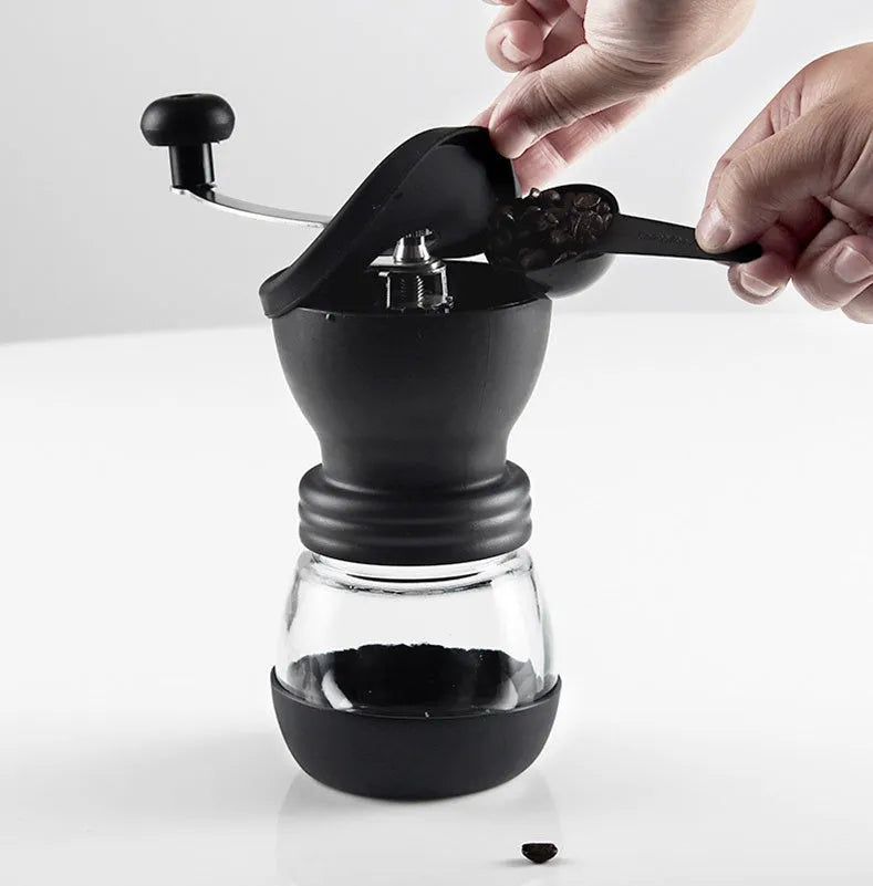Beech wood hand grinder coffee machine with black finish, 88 mm wide, on a table