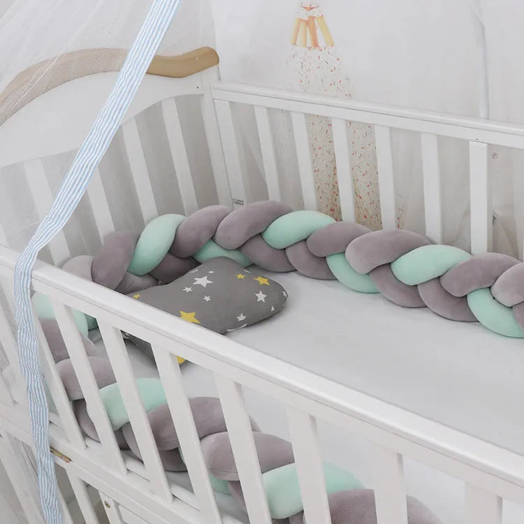 Braided knot baby crib bumper pillow in spandex velvet showing bendable design and colour options.