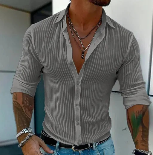 Man wearing a striped British style loose fit long sleeve cardigan shirt.