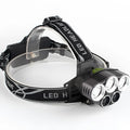 Outdoor head-mounted LED torch showing long-range beam, worn on head with adjustable strap.