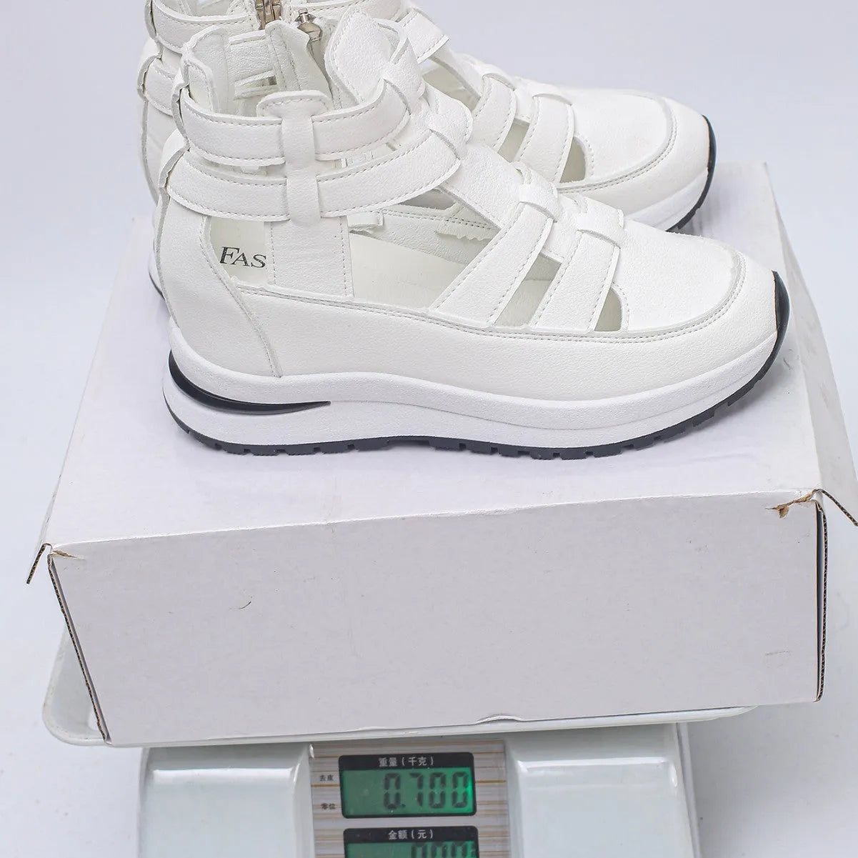 Women's black platform sandals with hollow-out design and Velcro strap.