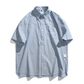 Blue striped short-sleeved overall shirt with cardigan style in cotton blend fabric