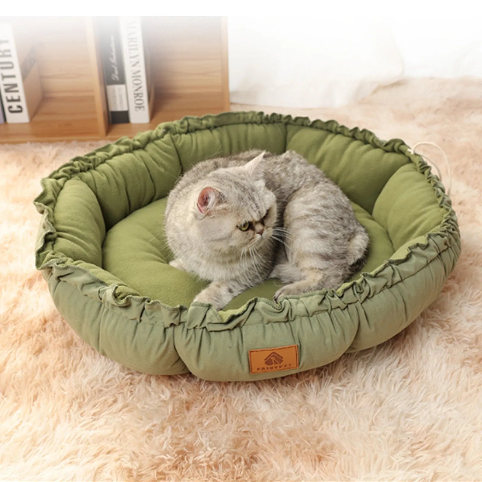 Grey and green reversible donut-shaped pet bed for cats and puppies, shown in small, medium, and large sizes.