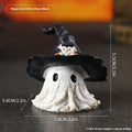 Small resin wizard hat ghost ornament in black or purple for holiday decoration.