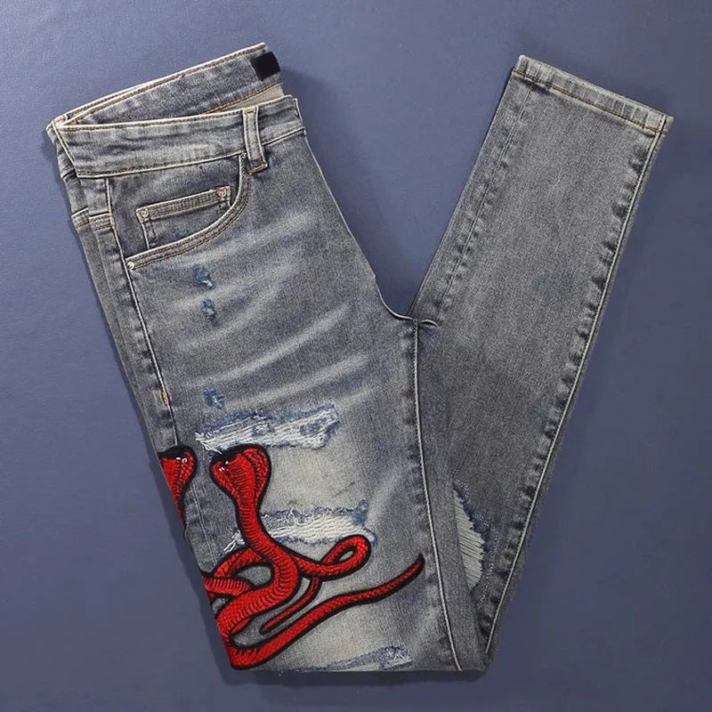 Old colour slim fit jeans with worn looking washed-out finish and trendy hole patch embroidery details