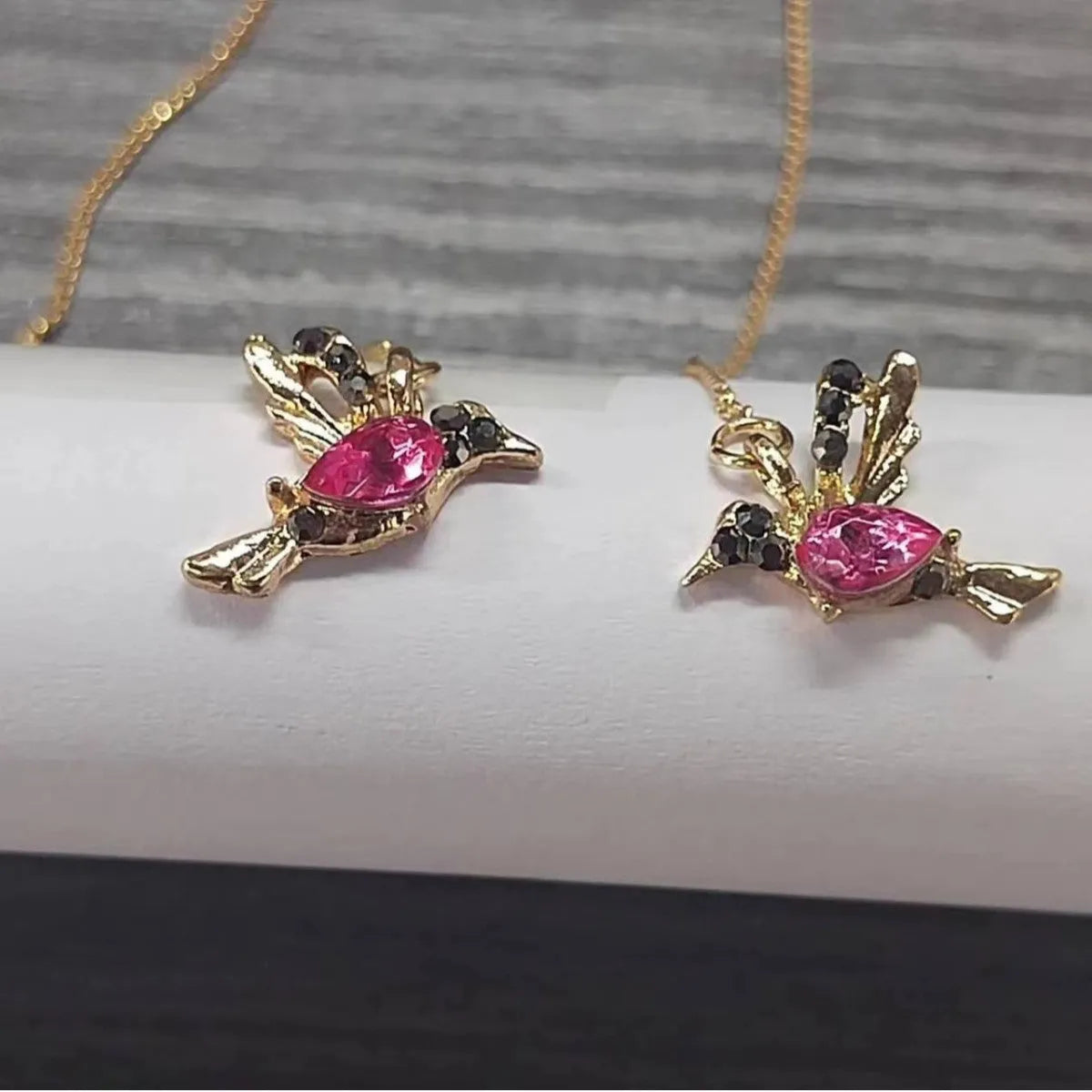 Long style hanging earrings featuring a bird design with mixed zirconium wings in red and blue electroplated alloy
