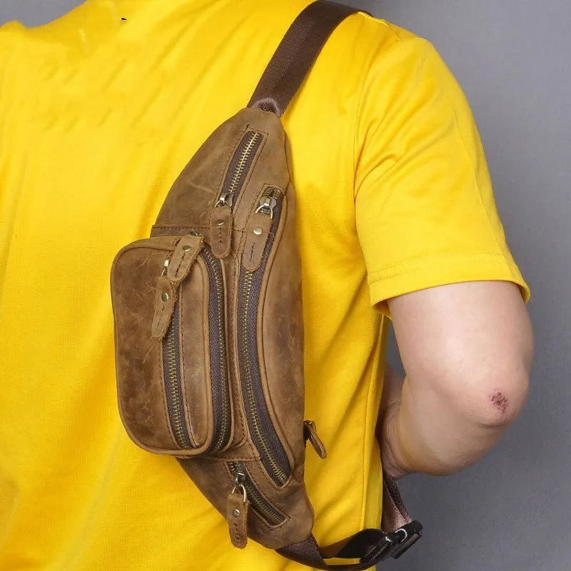 Brown leather retro messenger bag with a single shoulder strap shown open.