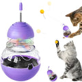 Interactive cat toy with slow food dispenser, teaser wand, and rocking base in pink, purple, or yellow